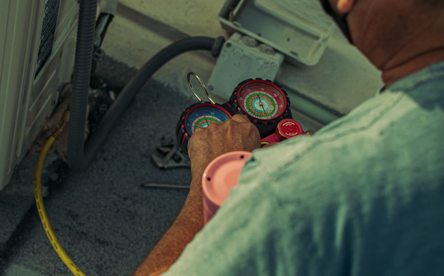 Technician servicing an HVAC unit