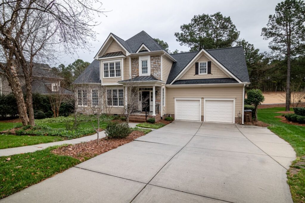 Clean suburban home exterior with manicured lawn