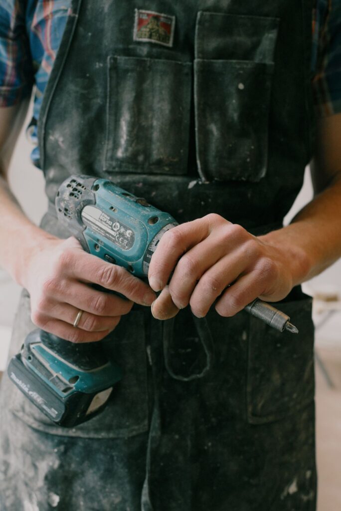 Handyman using a cordless drill for a repair