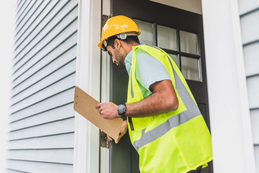 Inspector with a clipboard doing a property inspection