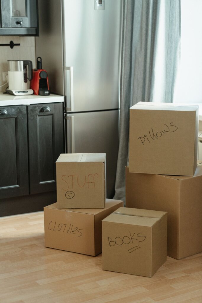 Labeled moving boxes in a new home kitchen