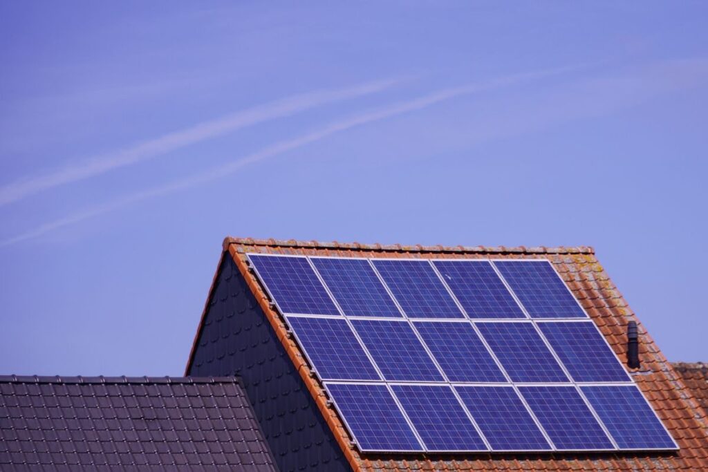 Solar panels on a residential roof under clear sky