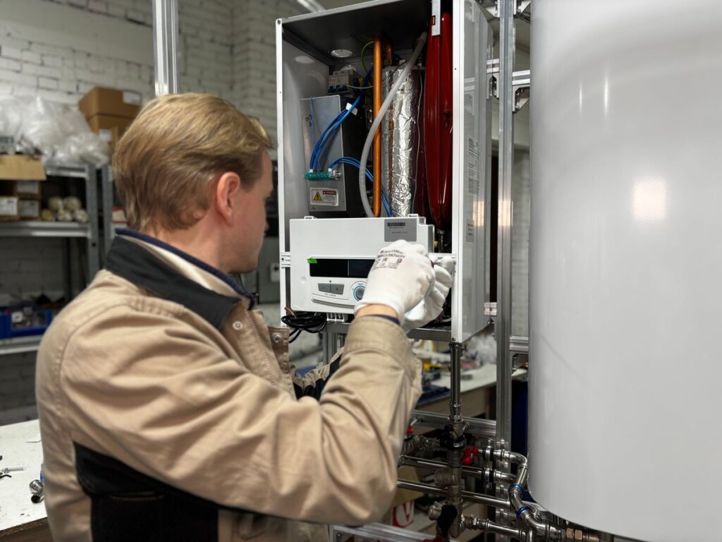 Technician servicing a home heating system